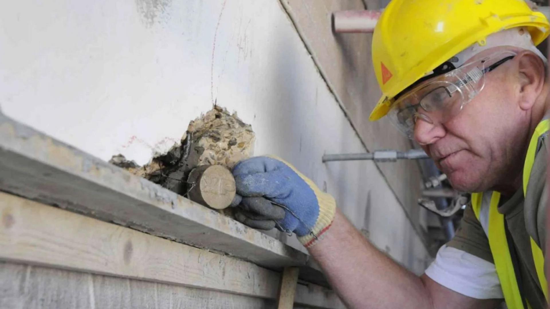 Engineer inspecting the condition of a concrete structure