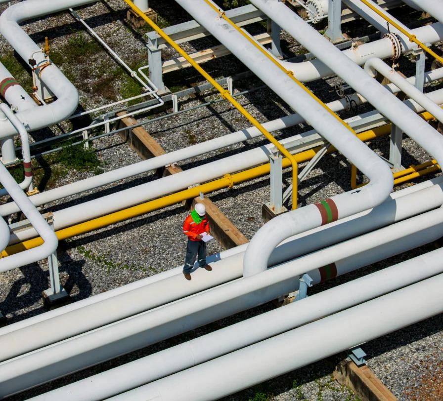 Engineer carrying out a field pipeline inspection