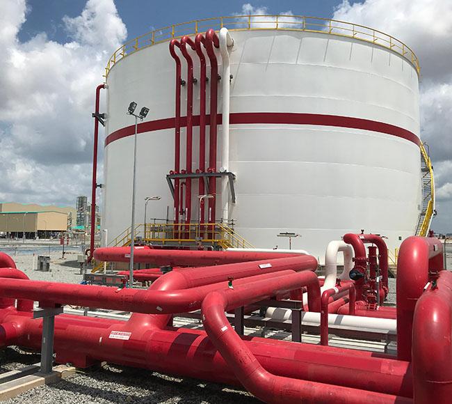 Fire-water storage tank and red pipework